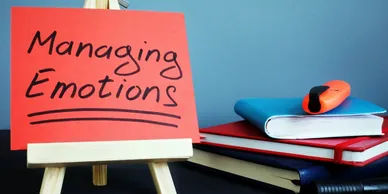 A red sign sitting on top of a table.